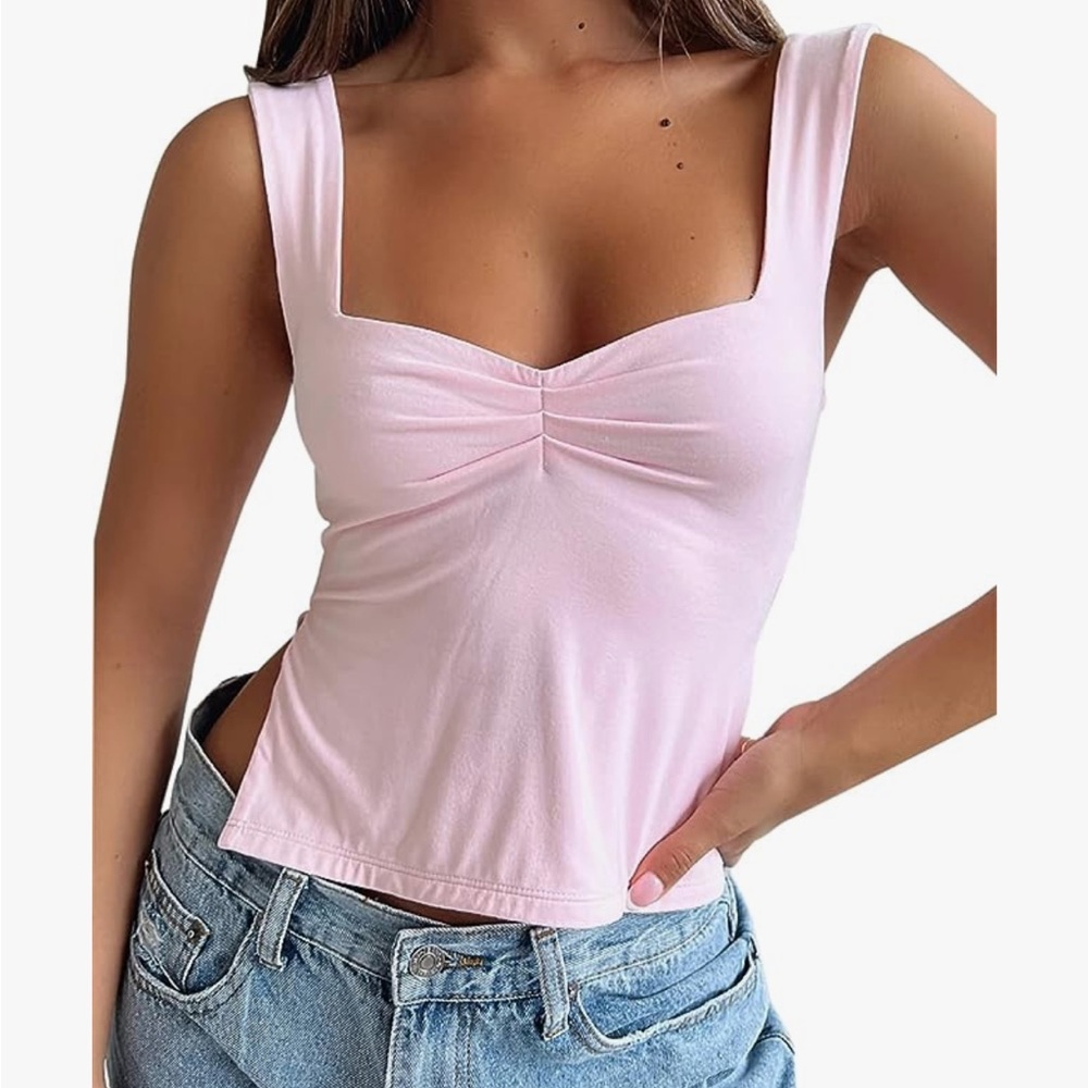 Pink tank with slits on sides size small.